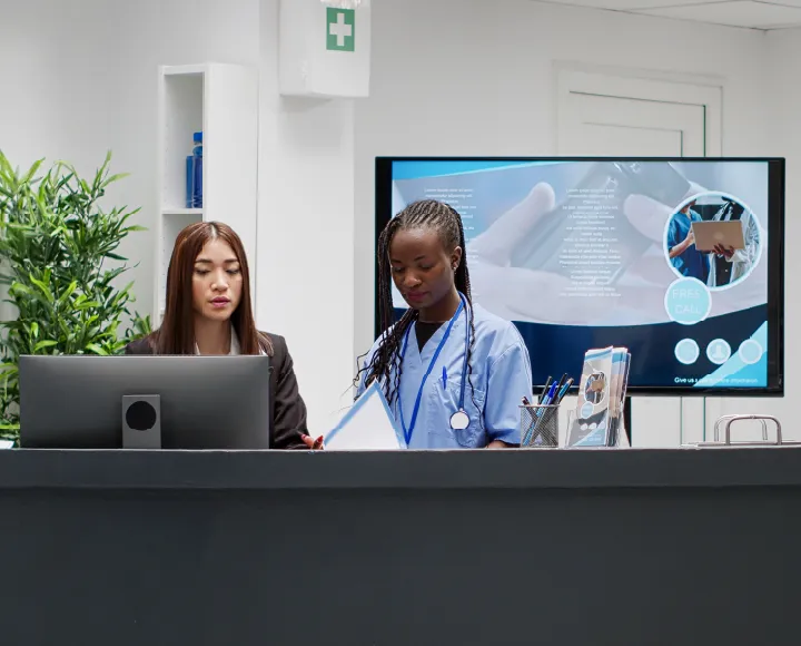 Healthcare clinic professional supporting a patient